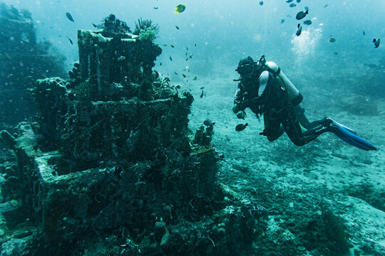 diver exploring underwater structure in Bali
