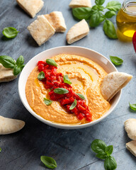 Roasted red pepper hummus with pita bread. Healthy food