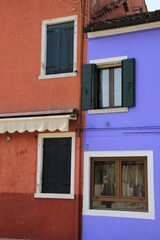 Italy, Veneto, Venezia: Detail of the contrast of colors of the houses of Burano Island.