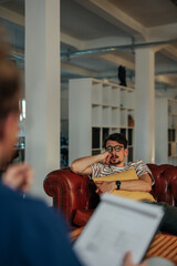 Depressed man talking with psychotherapist