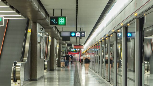 Subway train station interior timelapse in Central, Hong Kong. MTR is the most popular transport in Hong Kong