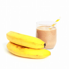 Protein cocktail in a glass and bananas isolated on white background, close-up. Healthy food concept