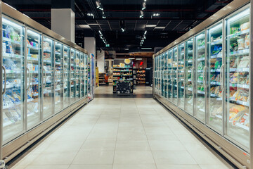 Empty supermarket aisle with refrigerators - 499654015