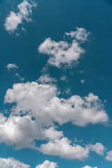 Bright white clouds floating on blue sky