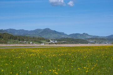 Landing small plane Mooney MSE in airport in Lachen (Switzerland)