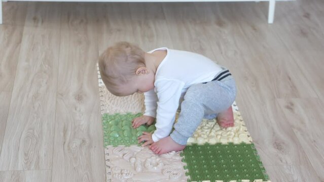 Toddler baby foot massage mat. Exercises for legs orthopedic massage carpet. High quality 4k footage