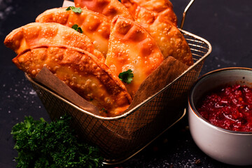 Fried mini pasties, with red sauce, top view, close-up, no people, selective focus,