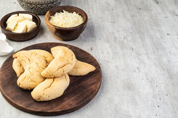 Chipas, typical south american cheese bun in a basket with copy space