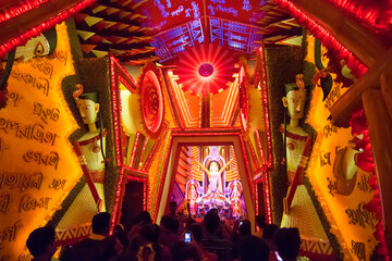 KOLKATA , INDIA - OCTOBER 18, 2015 : Night image of decorated Durga Puja pandal, shot at colored...