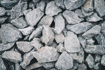 Gray stones gravel close up background.