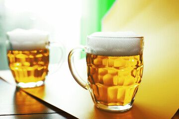 Saint Patrick's Day holiday. National Irish holiday. A mug of golden beer at the bar.