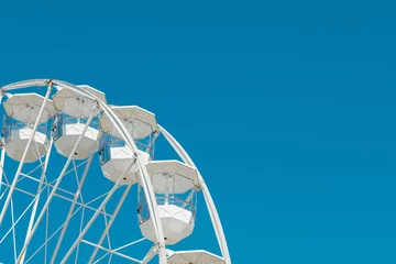 Deurstickers part of ferris wheel in front of blue sky © Stadtrandfoto