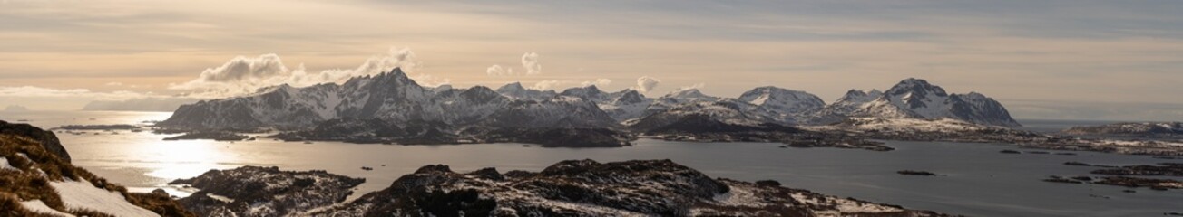 Panorama of mountain chain in Lofoten Norway. Vestvågøy. In the image you can see Ballstad, Gravdal, Leknes, with Reine in the distance on the left and Værøy out in the ocean. Spring day