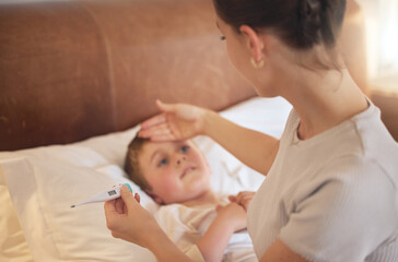 You definitely have a fever. Shot of a woman taking her little boys temperature with a thermometer in bed at home. - obrazy, fototapety, plakaty