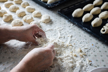  Woman cooking pies at home. Cooking and baking at home.