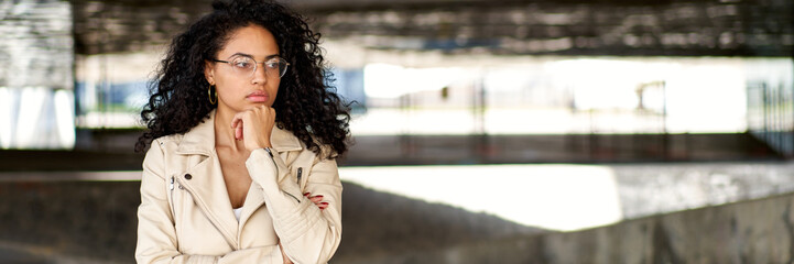 Beautiful latin girl wearing casual clothes serious face thinking about question with hand on chin, thoughtful about confusing idea