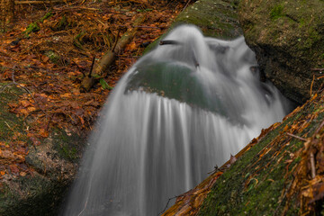 Cerveny creek with Cerveny waterfall in Jizerske mountains in spring morning