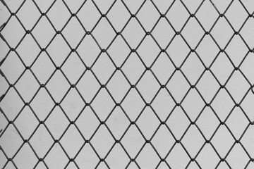 Steel Wire Mesh on Vintage White Wall Background