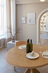 fashionable modern design luxury apartment in light colors. bright day behind huge windows. stylish decoration and no one inside.