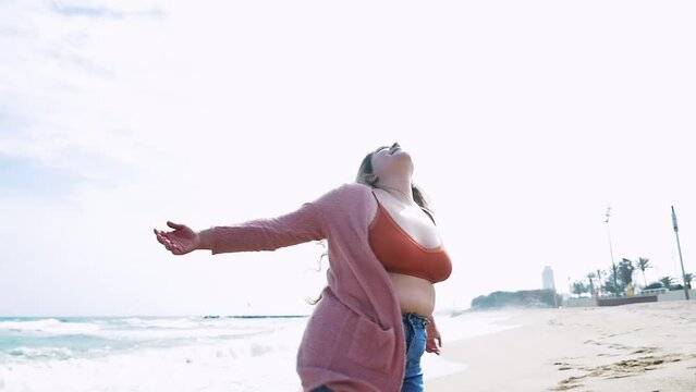 Beautiful curvy woman having fun outdoor on a beautiful day in Los Angeles, California. Body positive and self acceptance representation concepts