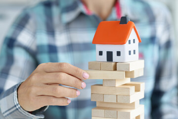 Woman takes out block on head with house