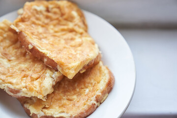 Close-up of delicious egg sandwiches in a white plate. The concept of a quick breakfast