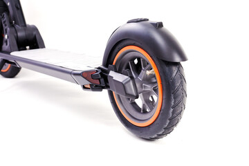 Electric wheel on a white studio background. Wheel from electric scooter. Modern city transport for young people and bussinesman.
