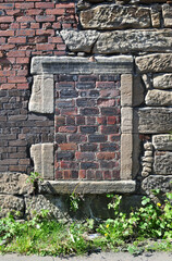 Ancient Stone Window Frame Sealed with Masonry 