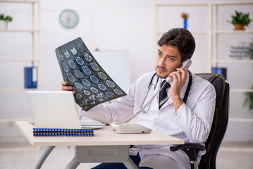 Young male doctor radiologist working in the clinic