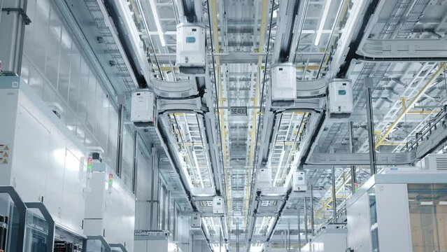 Wide Shot Inside Bright Advanced Semiconductor Production Fab Cleanroom with Working Overhead Wafer Transfer System 