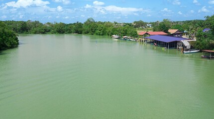 Obraz premium Aerial drone view of a river with a small jetty in Sedili Kecil, Johor, Malaysia