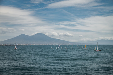 Calm blue Tyrrhenian Sea. View from the embankment of Naples to Mount Vesuvius volcano.