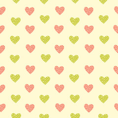 Cute vector seamless pattern with pink and green Hearts on a yellow background. Romantic Heart simple wallpaper. Valentines day background. Children's print.