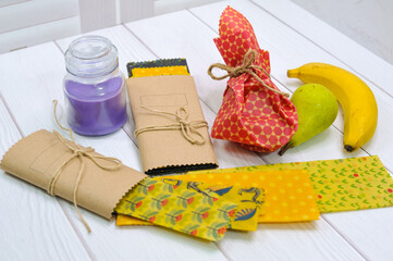 Fresh ripe banana and waxed napkin on green wooden table, top view. Space for text