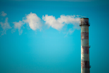 Smoke from the pipe of the heat station. Fuel. Sanctions. Energy. Environment. Pollution.