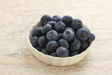 Sweet ripe blueberry heap in the bowl