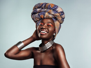 Nothing tops off your look like a stylish head wrap. Studio shot of a beautiful young woman wearing...