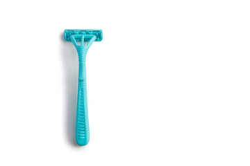 Disposable plastic razor on a white isolated background. Blue women's razor with free space for text on a white background. Skin care razor and neat look concept