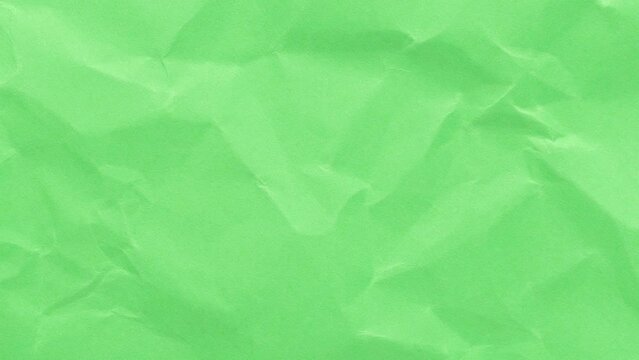 Wrinkled sheet of green paper. Textured backdrop