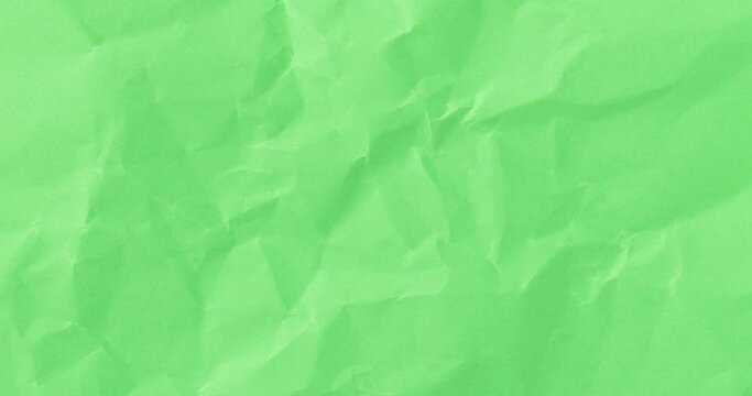 Wrinkled sheet of green paper. Textured backdrop