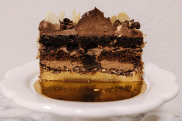 Close up of hulf of chocolate bento cake. Presentation cake on Easter bunny stand. Cake in section