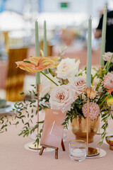 Wedding decor at the restaurant. Pink, gold, many pastel colors. 