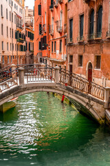 Fototapeta na wymiar Beautiful canals and traditional Venetian buildings in Venice, Italy