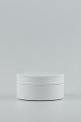 Unbranded white plastic jar for cosmetics products vertical mockup. Skincare and cosmetology branding identity template for text and design