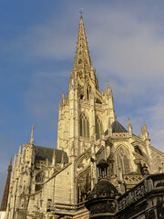 Fototapeta na wymiar Spire of the Roman catholic Saint Maclou church in gothic style Rouen, Frane