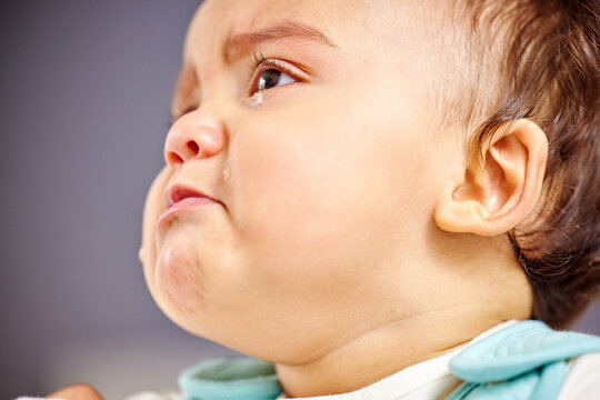 Its been a hard day. Shot of a little baby crying.