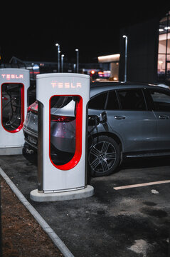 Sandefjord, Norway - februar 25, 2022: Silver Mercedes EQC Parked At Tesla Supercharger Station. The Mercedes EQC Is A Full-sized All-electric Five-door SUV
