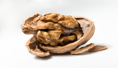 Walnuts are rounded, single-seeded stone fruits of the walnut tree. Cracking a nut.