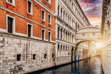 Fototapeta na wymiar View of the canals with the Bridge of Sighs at sunset in Venice, Italy - travel concept.