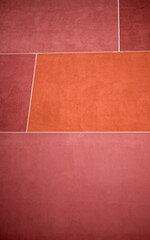Coral Red and Orange Block Wall Blocks with White Mortar.